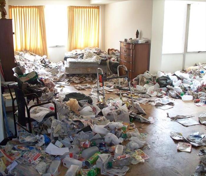Trash covering bedroom floor