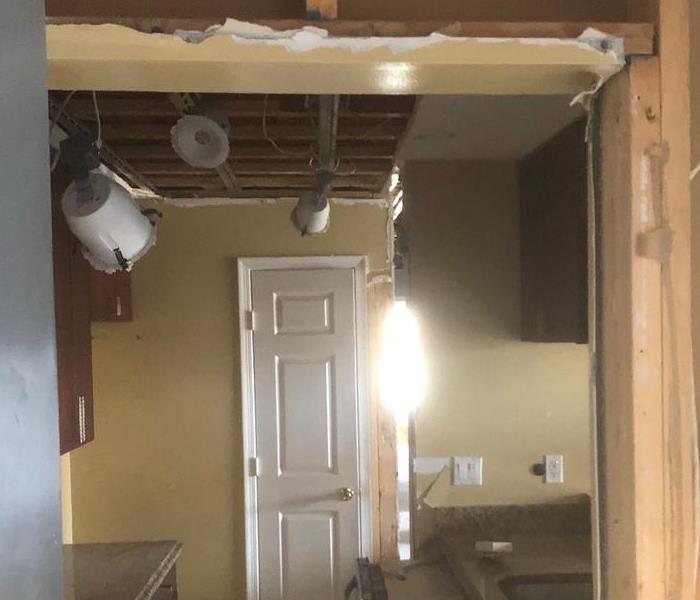 Water-damaged kitchen ceiling and floor