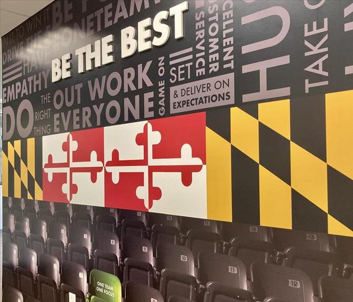 Black wall with Maryland flag and Be The Best message